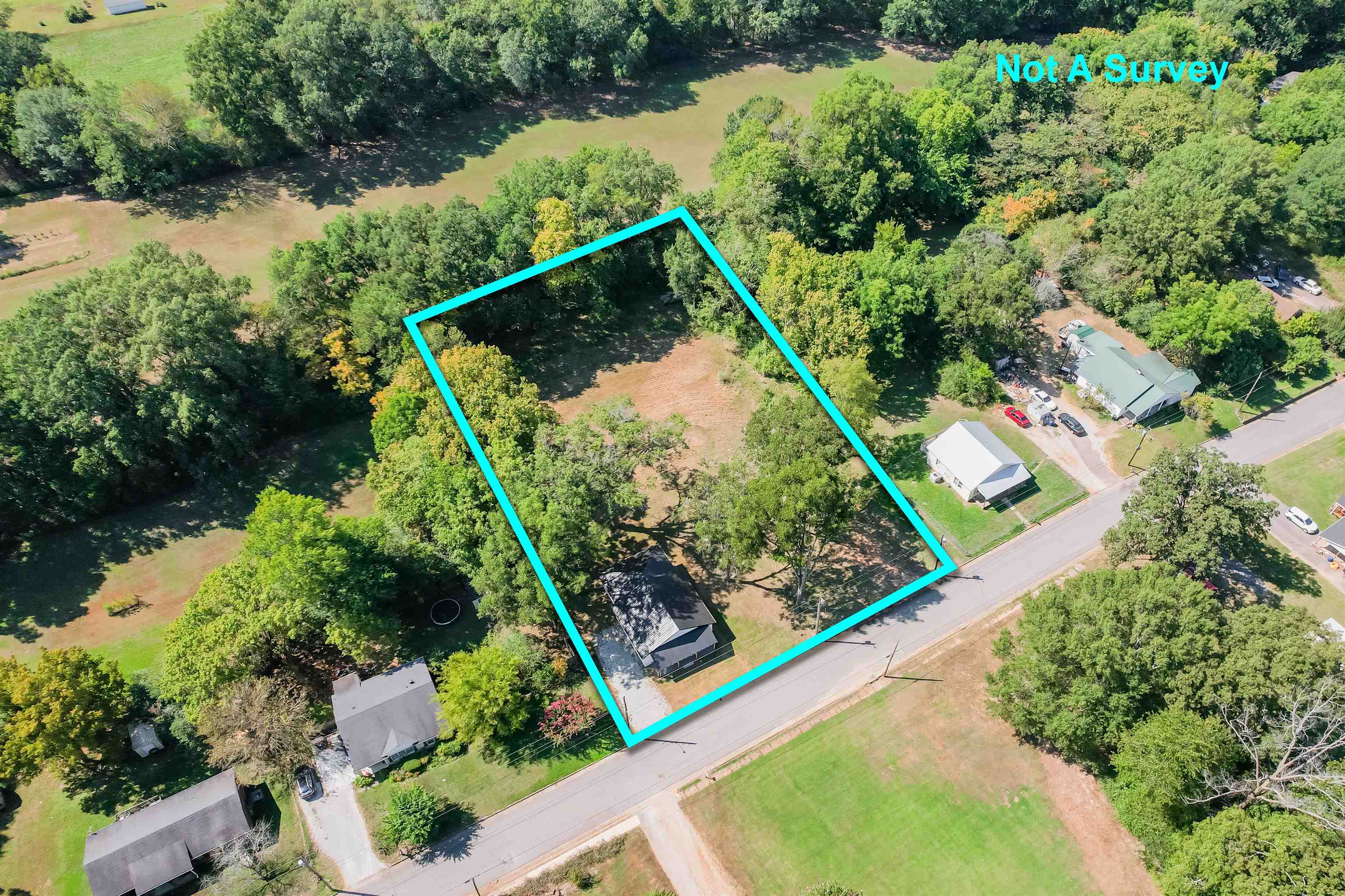 135 West 3rd Street Henderson, TN 38340 - Photo 23 of 31 Aerial view of property and surrounding area featuring property parcel outlined