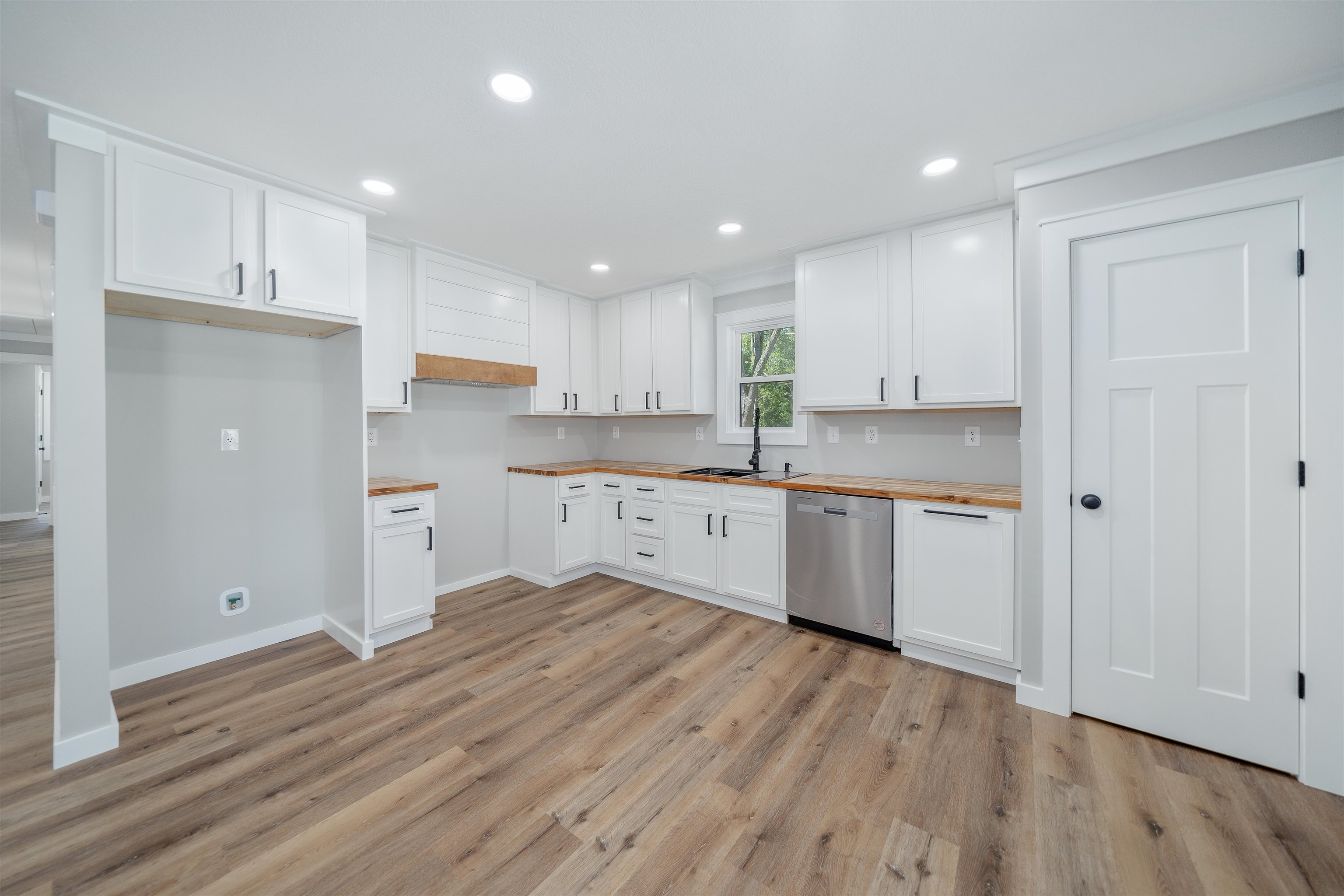 135 West 3rd Street Henderson, TN 38340 - Photo 26 of 31 Kitchen featuring white cabinetry, recessed lighting, dishwasher, light wood-style flooring, and wooden counters