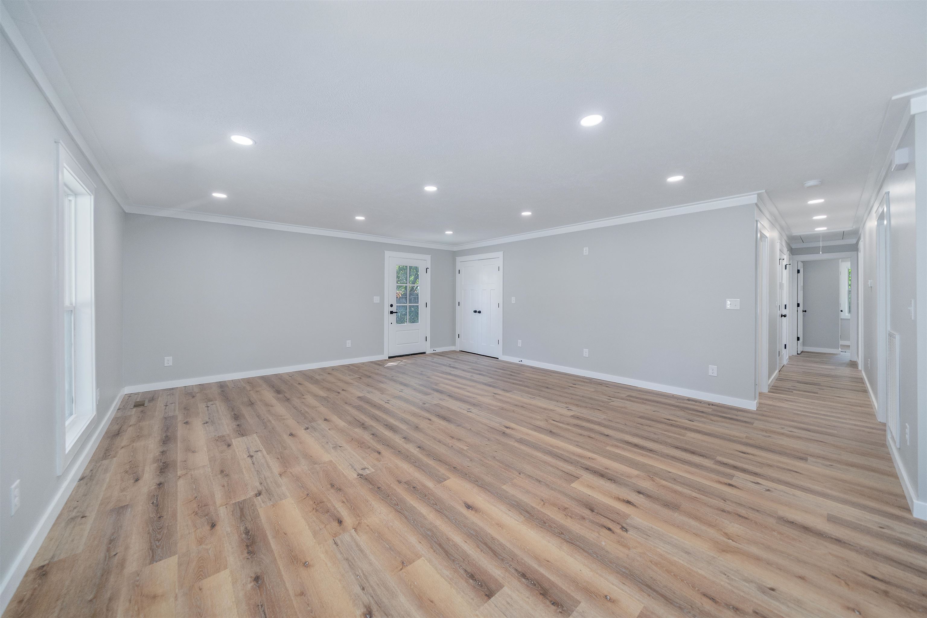 135 West 3rd Street Henderson, TN 38340 - Photo 28 of 31 Unfurnished living room with ornamental molding, light wood-style floors, and recessed lighting