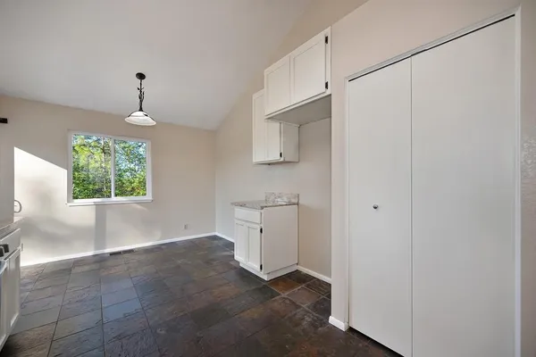a view of a kitchen with a sink and a window