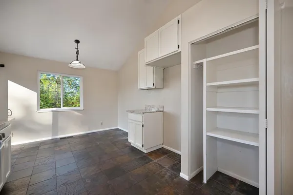 a view of an empty room with a window