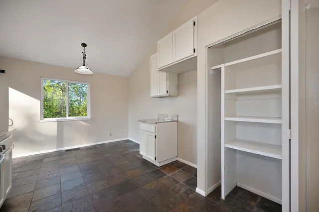 a view of an empty room with a window