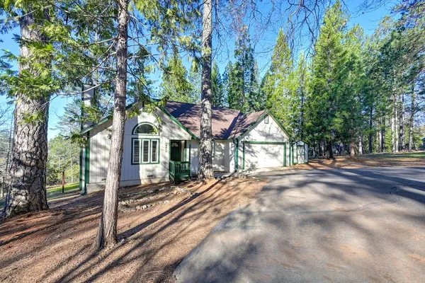 a house with trees in front of it