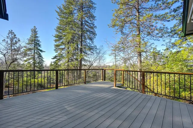 a view of balcony with wooden floor