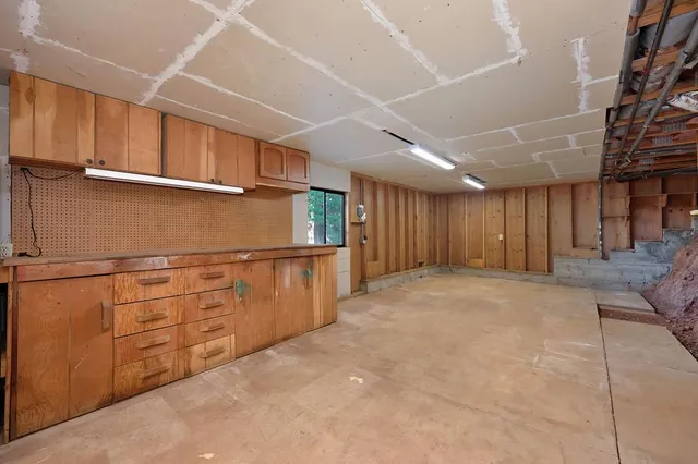 a view of an empty room with closet