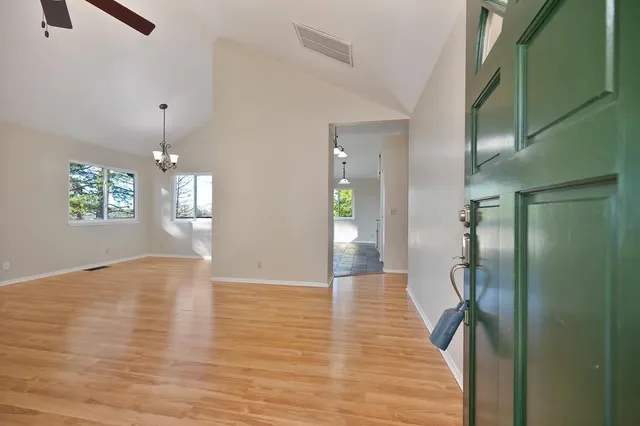 a view of livingroom with hardwood floor and hallway