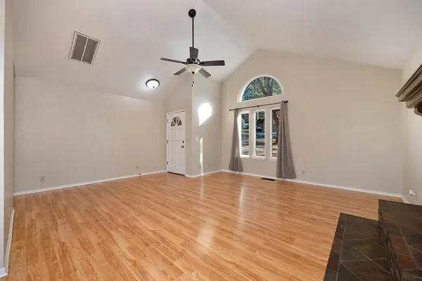 a view of a big room with windows and cabinet
