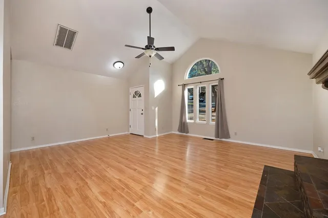 a view of a big room with windows and cabinet