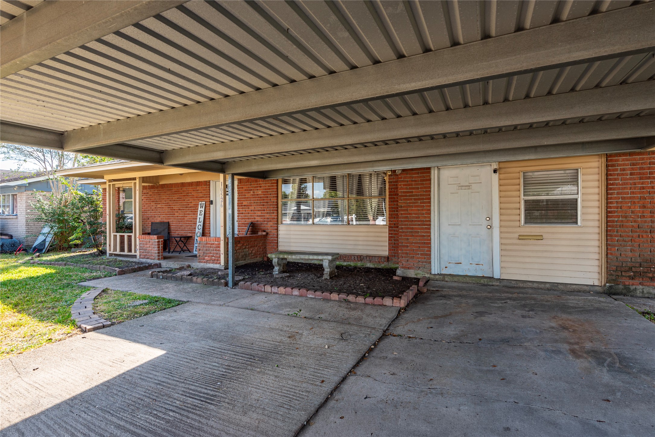10526 Tolman Street Houston, TX 77034 - Photo 2 of 22 a backyard of a house with yard and outdoor seating