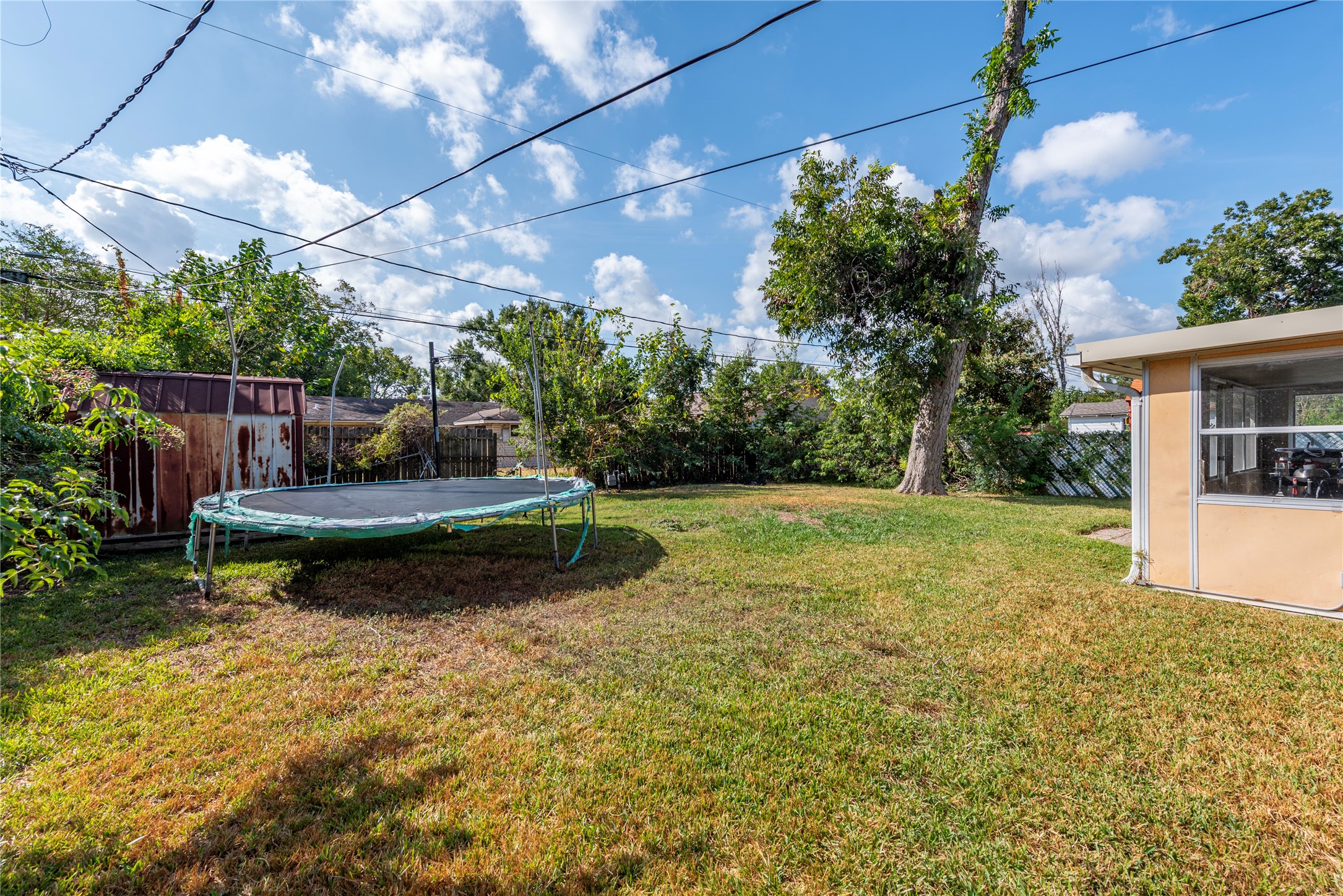 10526 Tolman Street Houston, TX 77034 - Photo 22 of 22 a backyard of a house with lots of green space