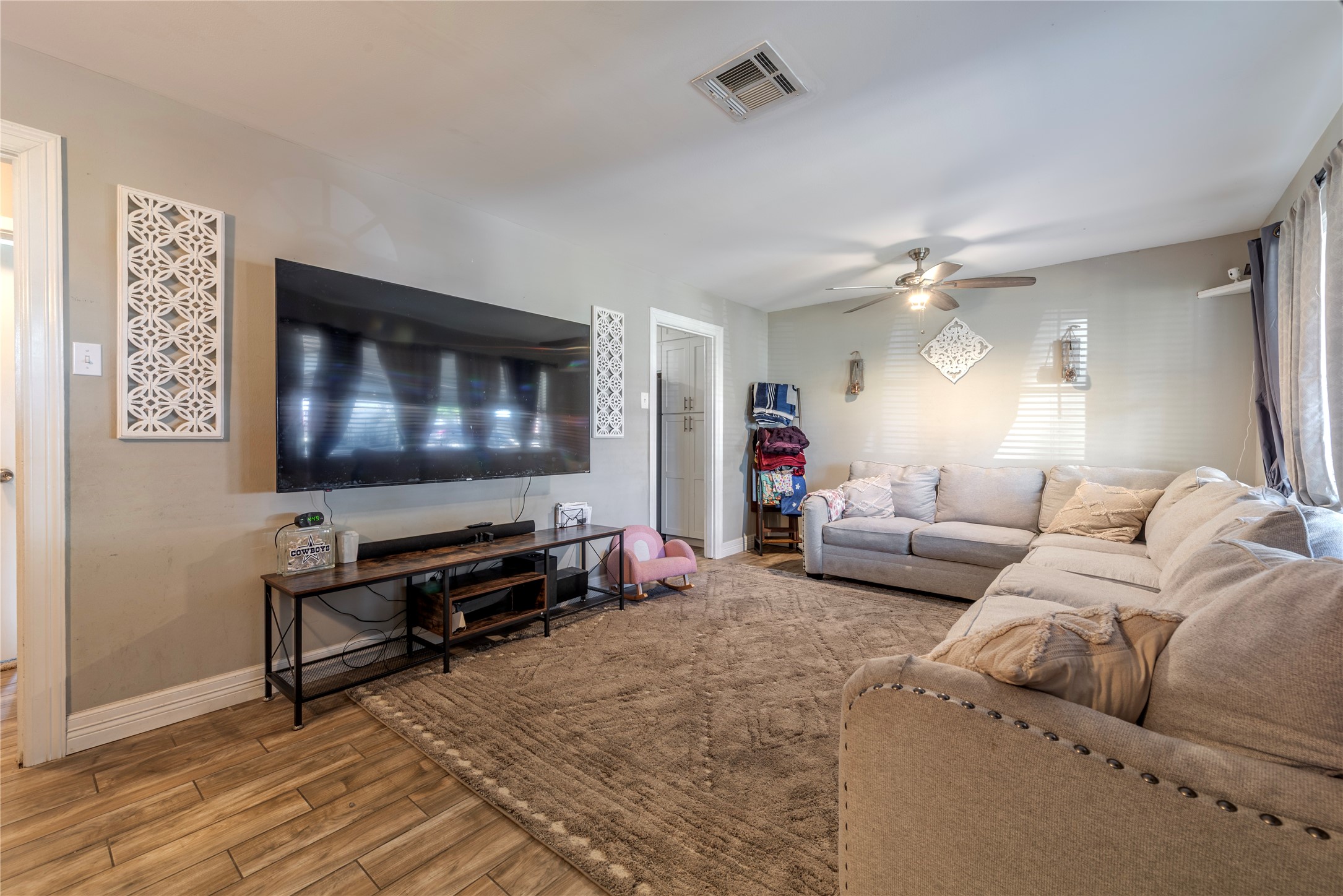 10526 Tolman Street Houston, TX 77034 - Photo 4 of 22 a living room with furniture and a flat screen tv