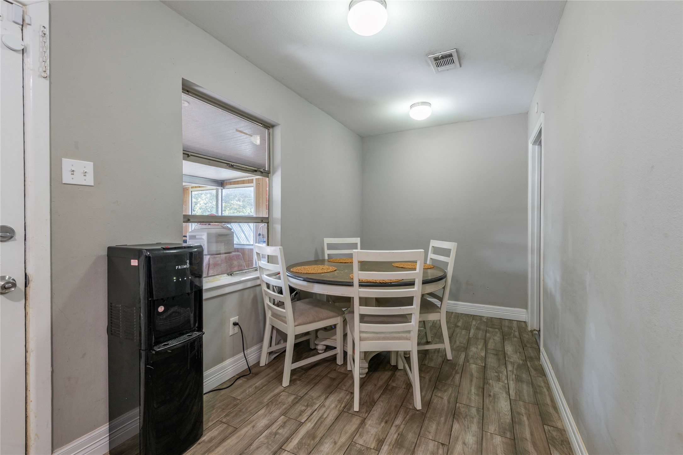 10526 Tolman Street Houston, TX 77034 - Photo 10 of 22 a dining room with furniture and window