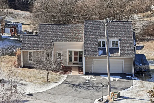 a front view of a house with parking