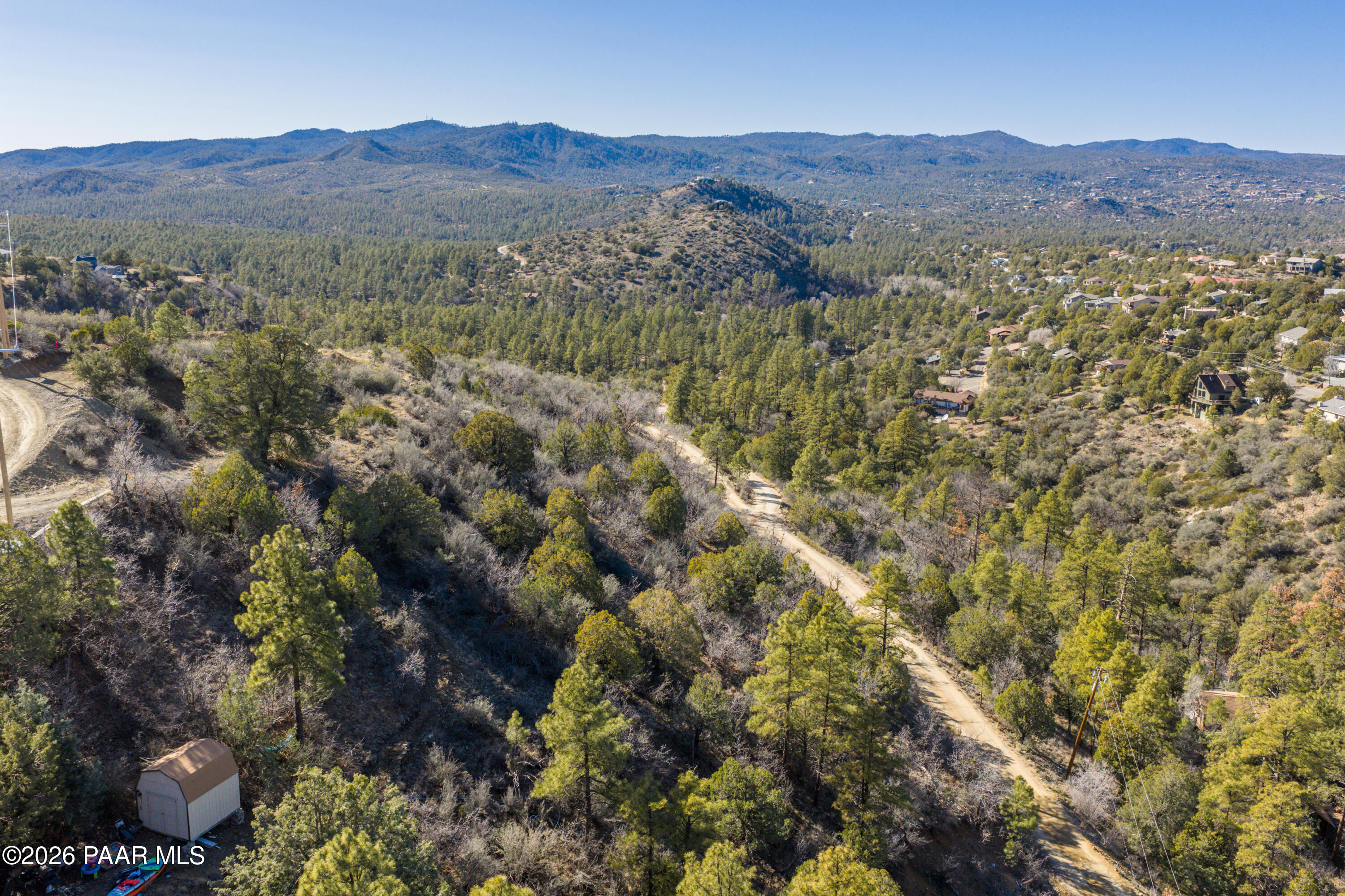 1490 South Rattlesnake Way Prescott, AZ 86303 - Photo 12 of 24 a view of a lush green hillside and a houses