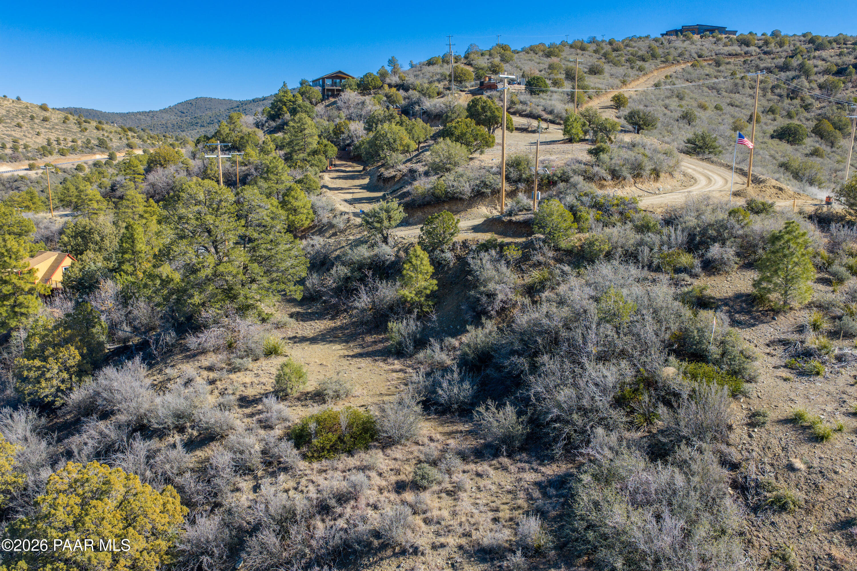 1490 South Rattlesnake Way Prescott, AZ 86303 - Photo 24 of 24 a view of a large building with mountains in the background