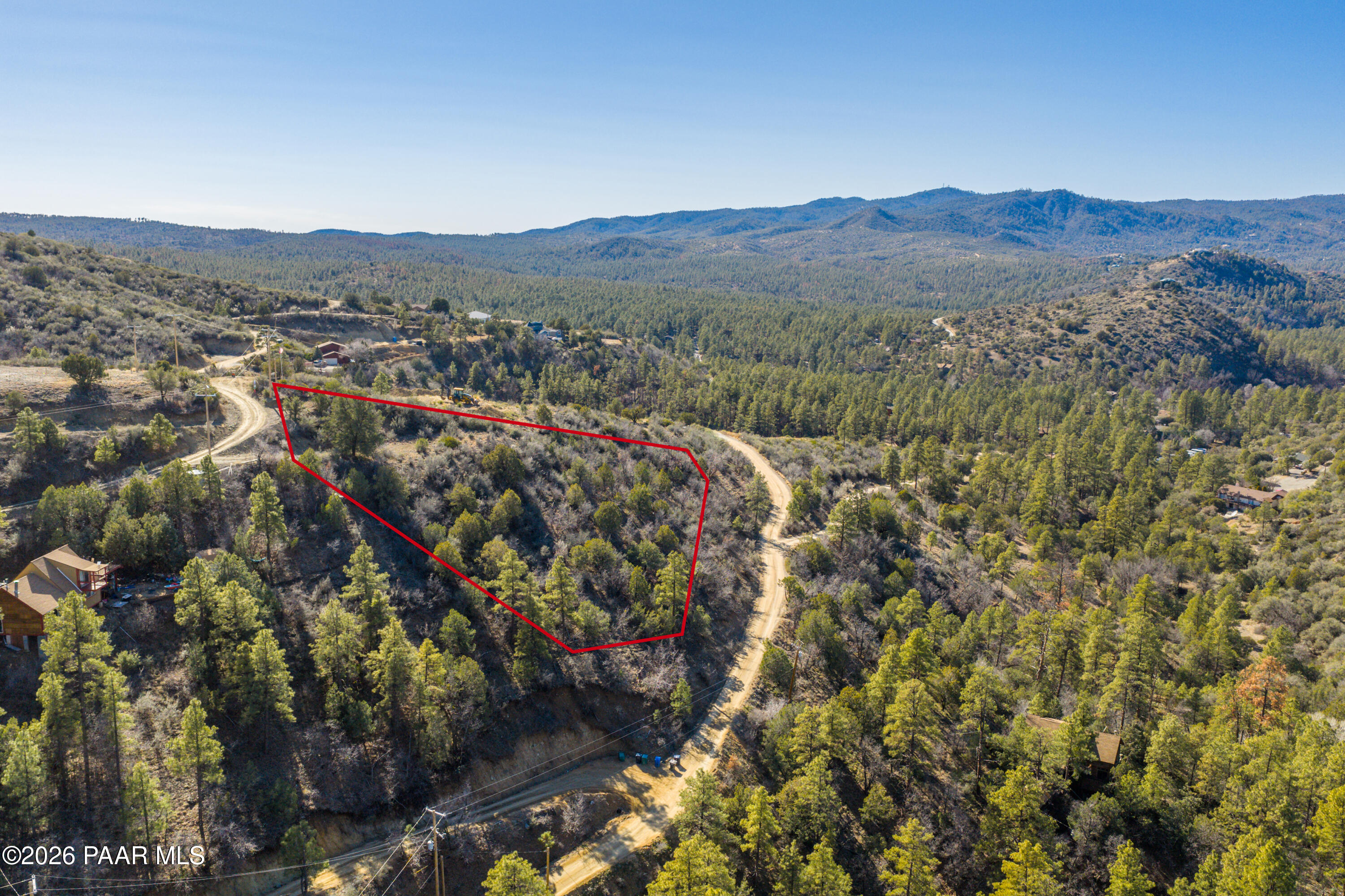 1490 South Rattlesnake Way Prescott, AZ 86303 - Photo 5 of 24 a view of a forest with mountains in the background
