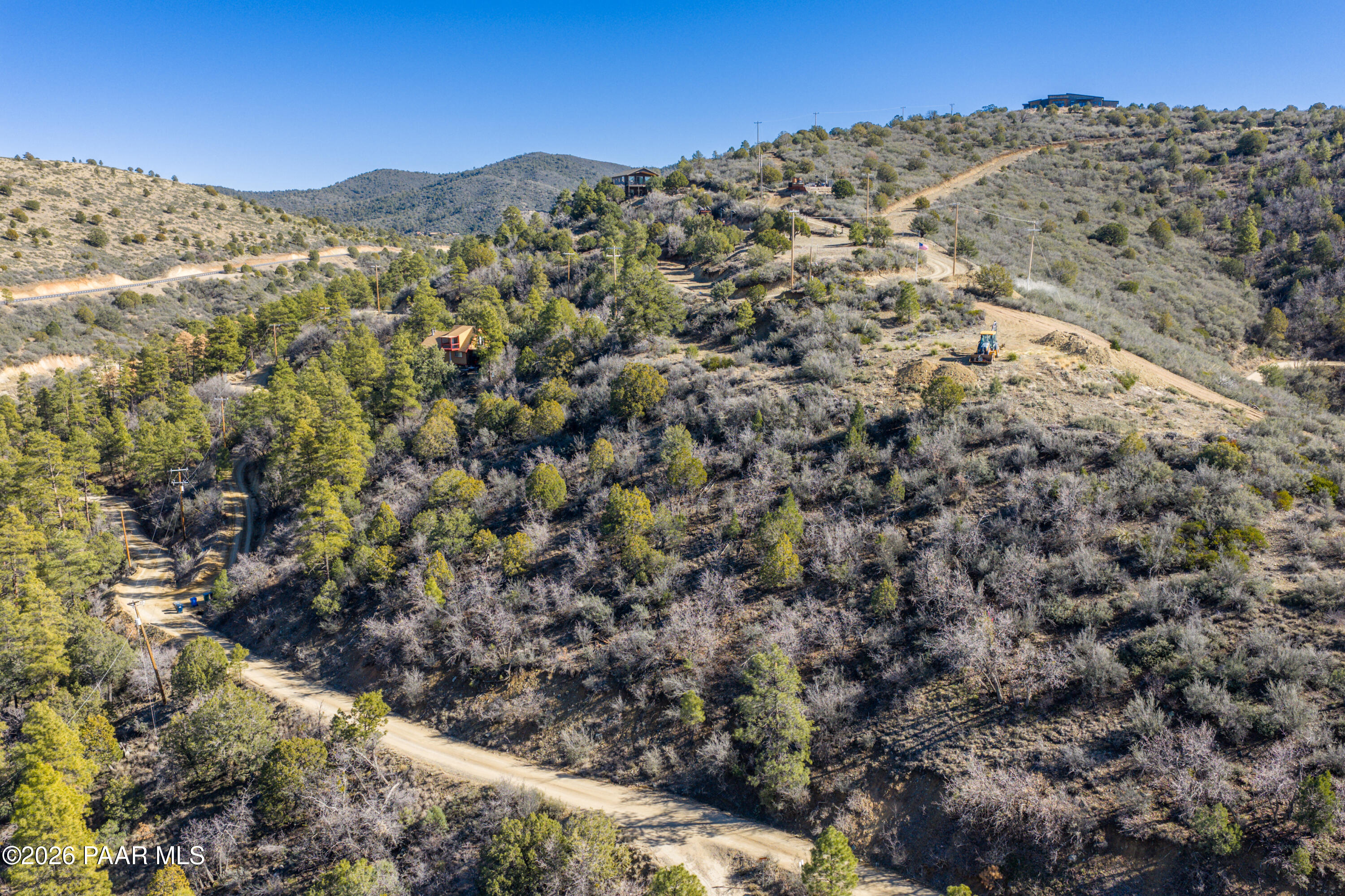1490 South Rattlesnake Way Prescott, AZ 86303 - Photo 8 of 24 a view of a large building with mountains in the background