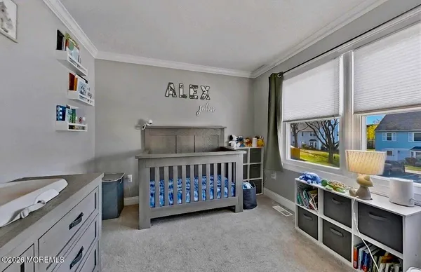 a bedroom with furniture and a window