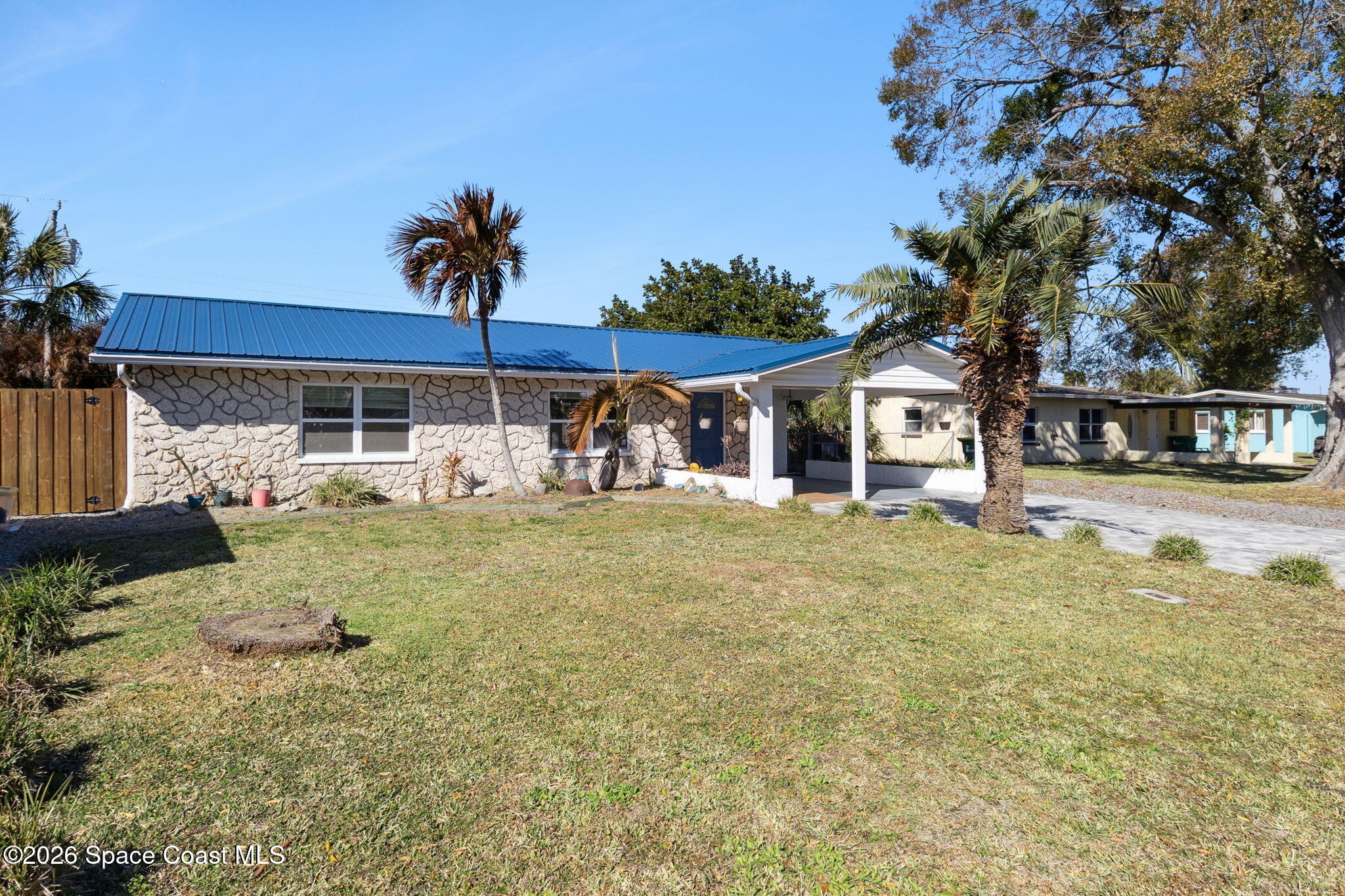 207 2nd Street Merritt Island, FL 32953 - Photo 19 of 19 a front view of a house with garden