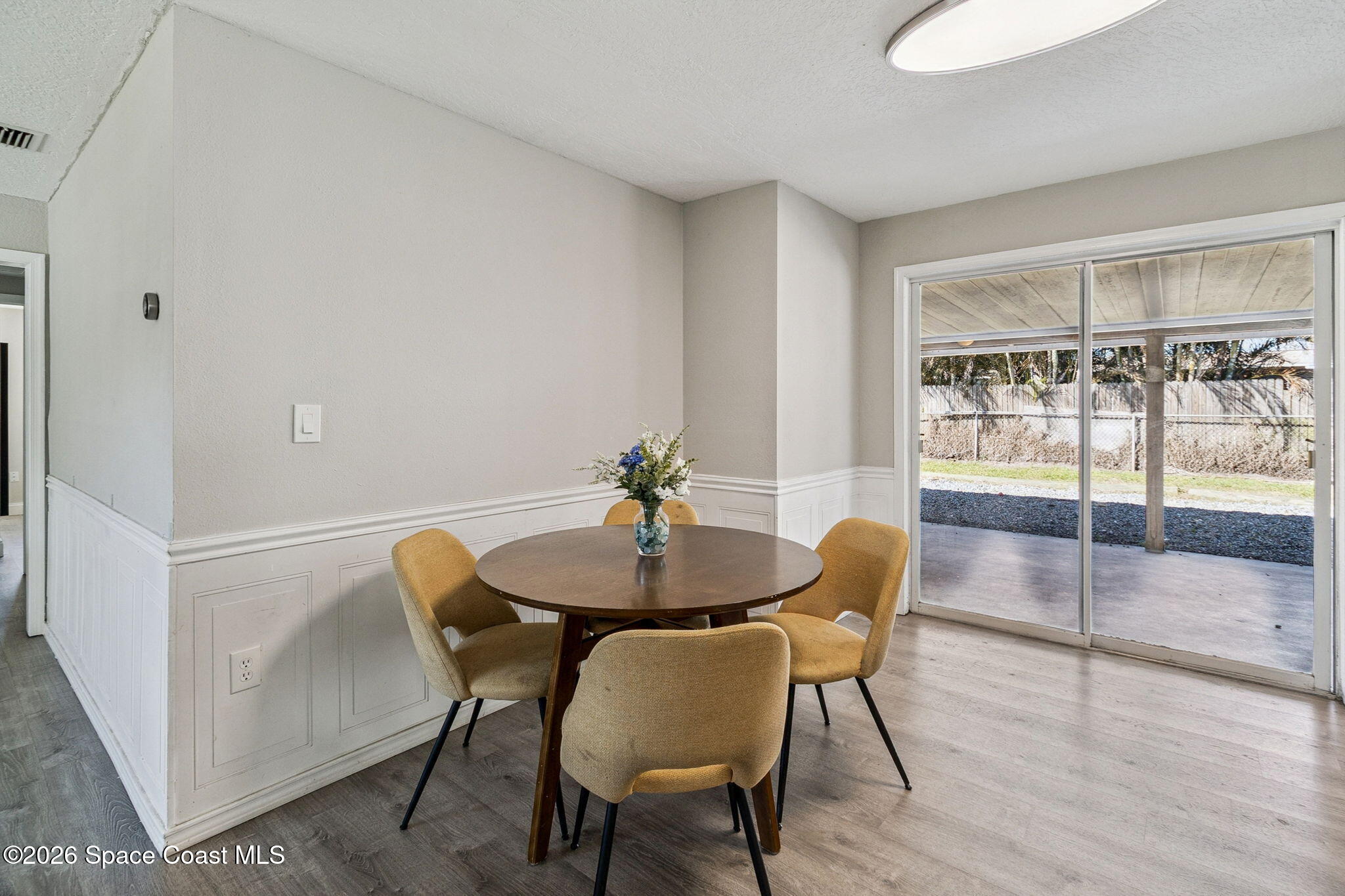 207 2nd Street Merritt Island, FL 32953 - Photo 5 of 19 a view of a dining room with furniture and wooden floor