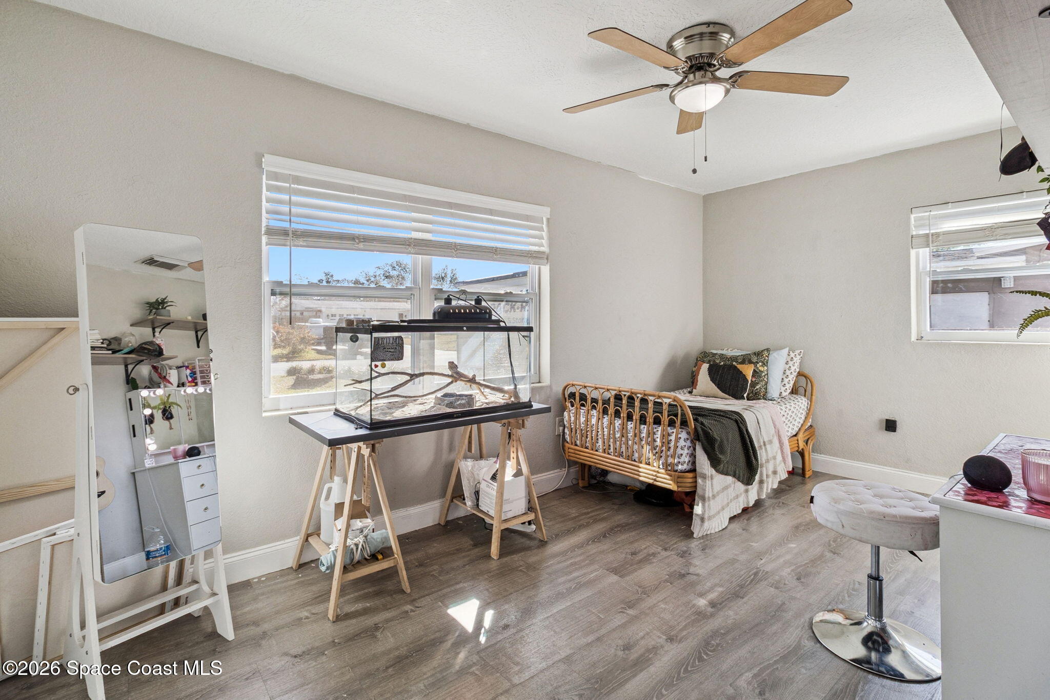 207 2nd Street Merritt Island, FL 32953 - Photo 10 of 19 a bedroom with furniture and a wooden floor