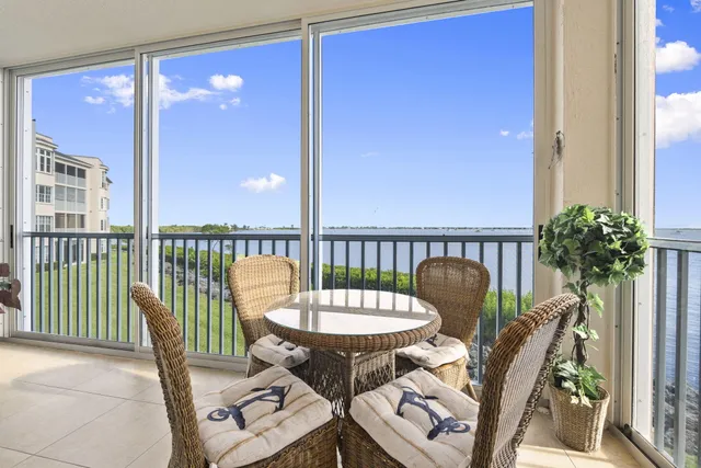 a view of a chair and table in the balcony