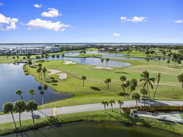 a view of a lake with a yard