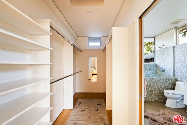 a bathroom with a glass shower door