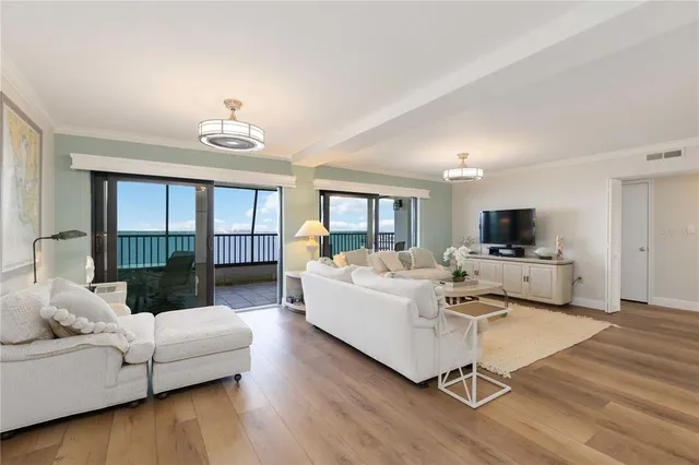 a bedroom with two beds and a chandelier