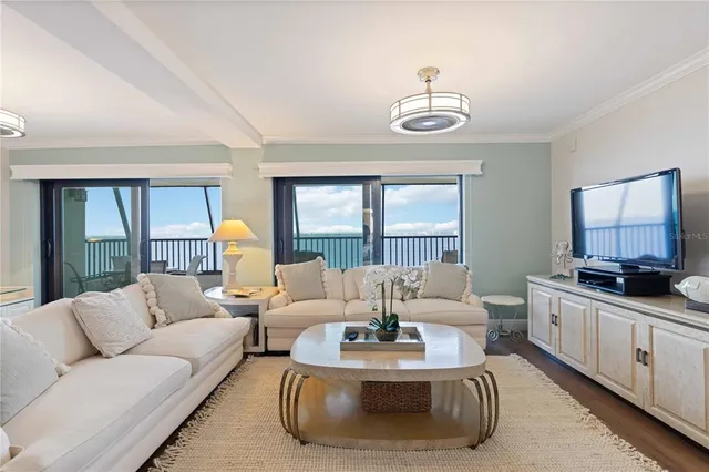 a bedroom with a bed and a television