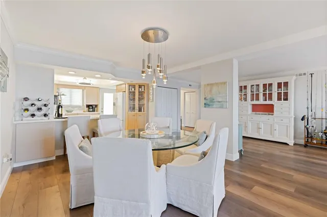 a bathroom with a granite countertop sink toilet and mirror