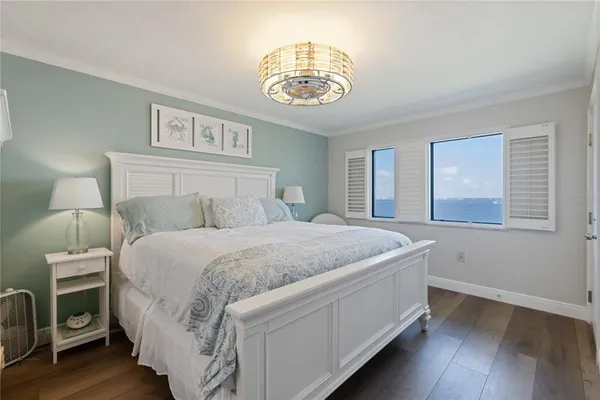 a large white bed in a white room