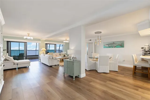 a bedroom with two beds and a chandelier