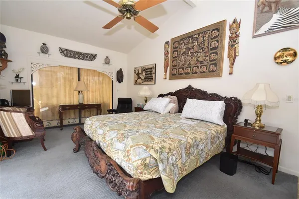 a bedroom with bed and window