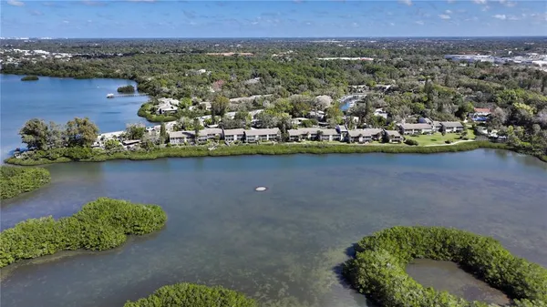 an aerial view of a house with a lake view