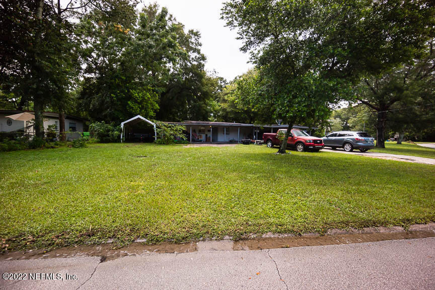 6836 Morgana Road North Jacksonville, FL 32211 - Photo 1 of 15 a view of a house with a yard and sitting area