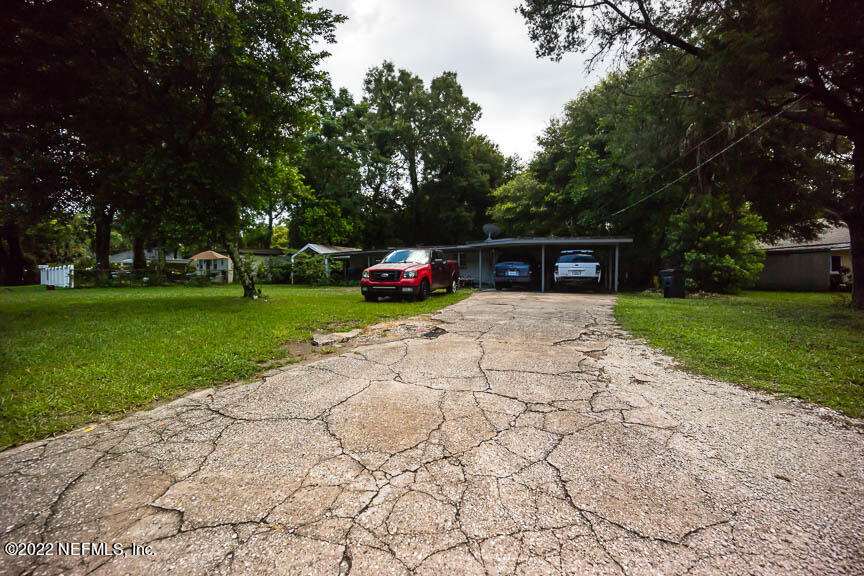 6836 Morgana Road North Jacksonville, FL 32211 - Photo 2 of 15 a view of a house with garden and yard
