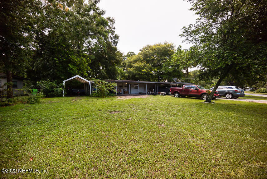6836 Morgana Road North Jacksonville, FL 32211 - Photo 3 of 15 a view of yard with green space and seating area