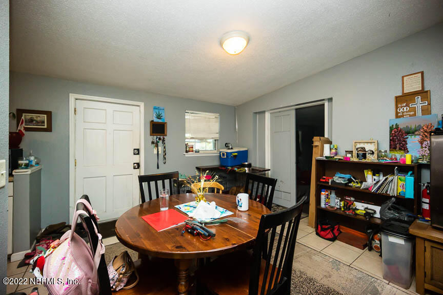 6836 Morgana Road North Jacksonville, FL 32211 - Photo 7 of 15 a living room with furniture and a flat screen tv