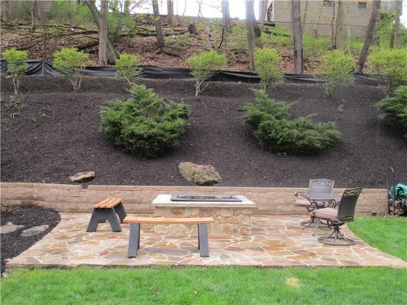 147 Three Degree Road Pittsburgh, PA 15237 - Photo 20 of 25 Exterior Back. The Fire Pit Area surrounded by Professional Landscaping