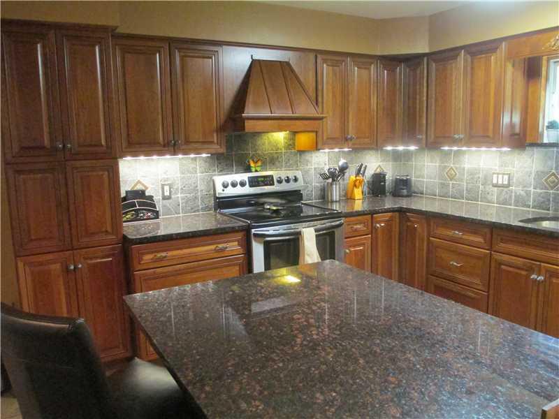 147 Three Degree Road Pittsburgh, PA 15237 - Photo 6 of 25 Kitchen. amazing amounts of beautiful cabinetry, pantry space, plenty of granite counter surfaces and Island, beautiful tile backsplash!