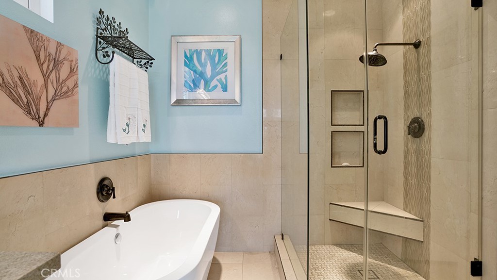24965 Seagate Drive Dana Point, CA 92629 - Photo 32 of 44 Master Bathroom - Features freestanding tub and tile surround walls.