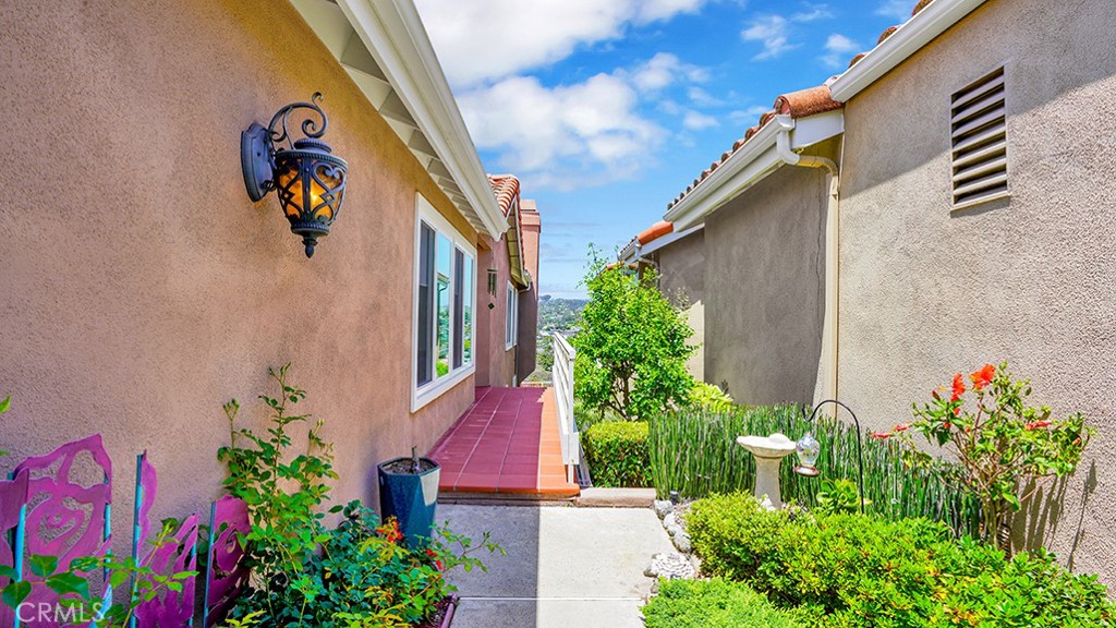 24965 Seagate Drive Dana Point, CA 92629 - Photo 43 of 44 Private entrance to home set back behind wrought-iron gate.