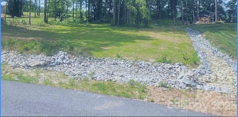 Lot 9 Clark Road Hendersonville, NC 28792 - Photo 5 of 6 a view of a yard with a tree