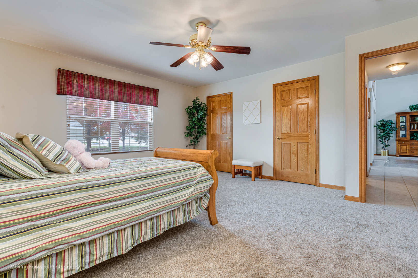 1909 Eagle Drive Morris, IL 60450 - Photo 20 of 24 a spacious bedroom with a bed and a chandelier
