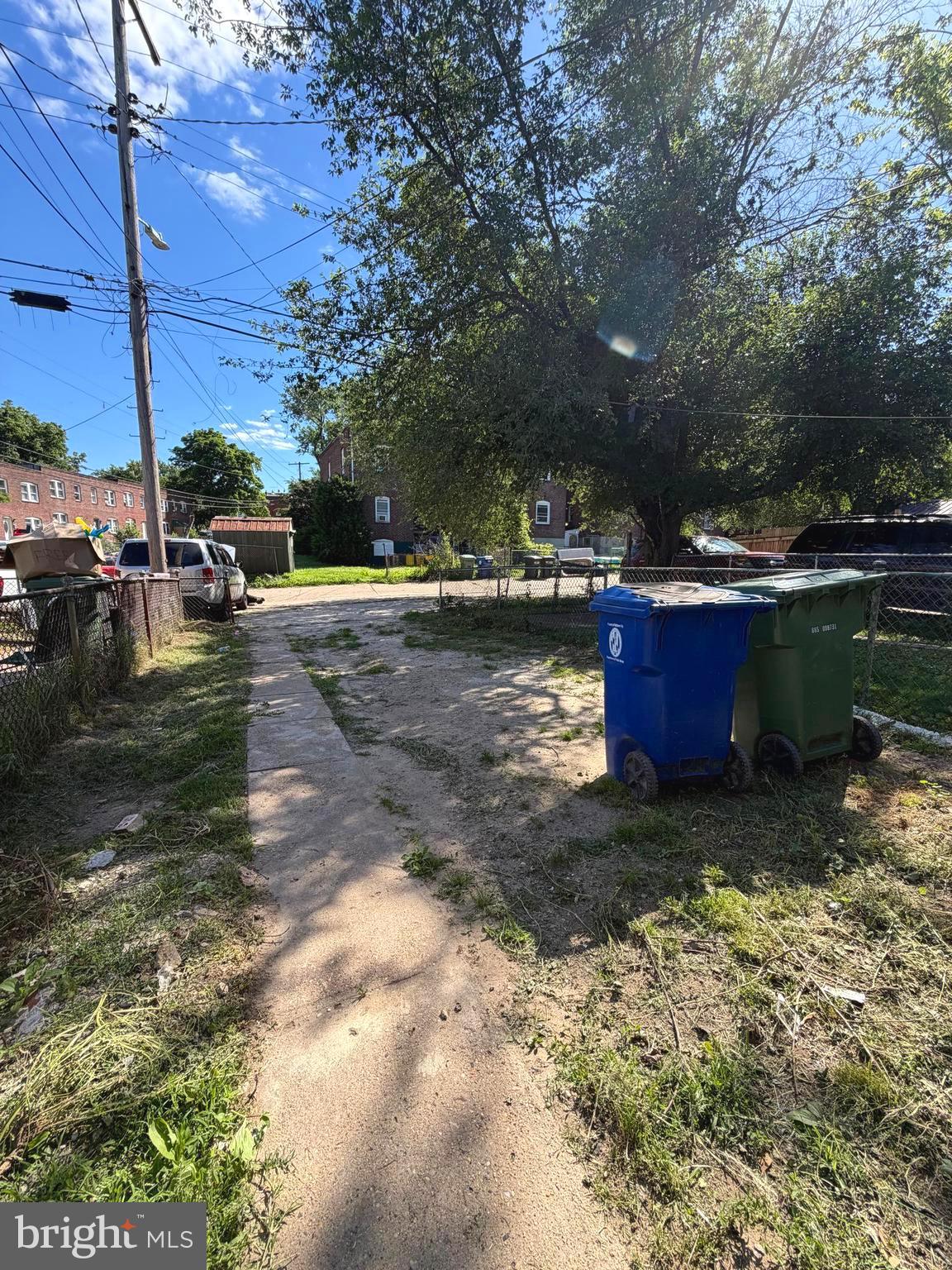 1353 Cambria Street Baltimore, MD 21225 - Photo 23 of 23 a view of a yard with large trees