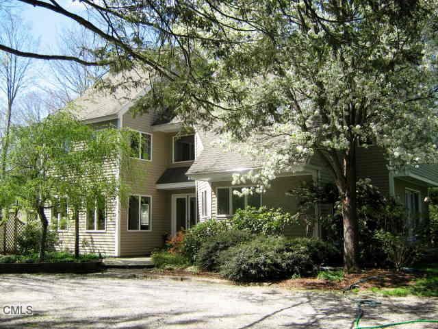 165 Weston Road Weston, CT 06883 - Photo 1 of 1 a front view of a house with a yard