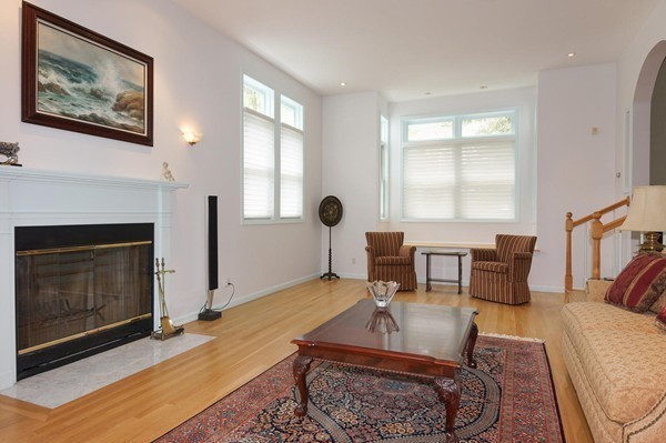69 Wayside Road, Unit 69 Concord, MA 01742 - Photo 3 of 22 a living room with furniture a window and a fireplace