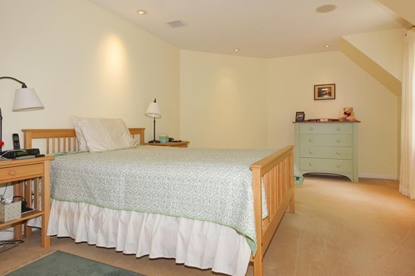 69 Wayside Road, Unit 69 Concord, MA 01742 - Photo 10 of 22 a bedroom with a bed and a desk