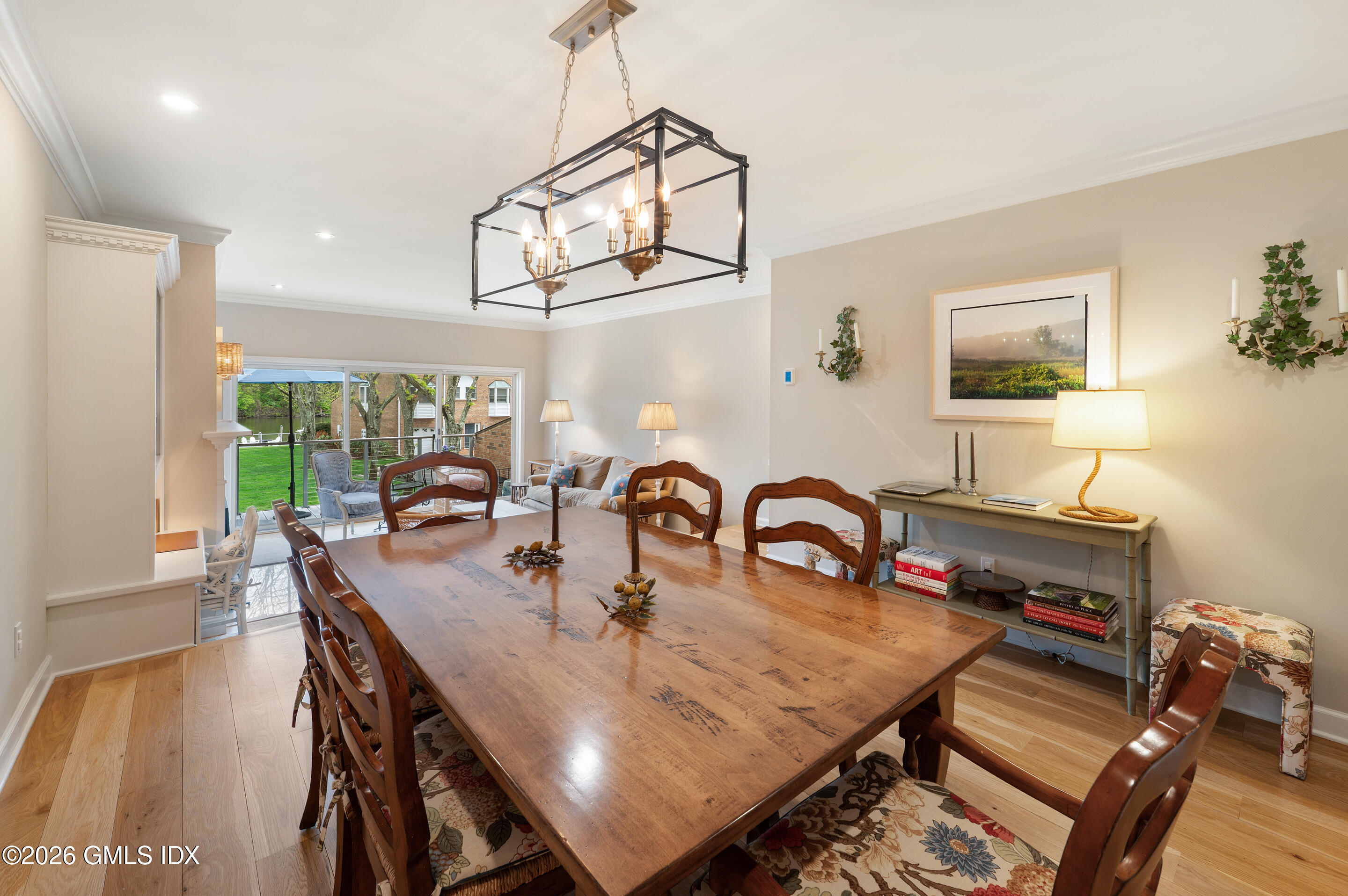 115 River Road, Unit 3 Cos Cob, CT 06807 - Photo 23 of 40 a dining room with furniture a rug and wooden floor